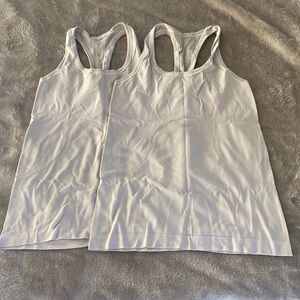 Two used Lululemon swiftly tech tanks Sz 6 white